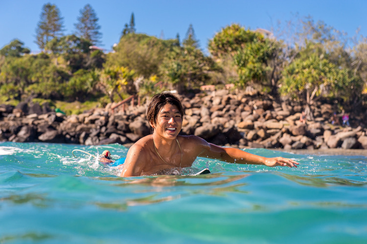 Image paddling-on-a-surfboard.jpg